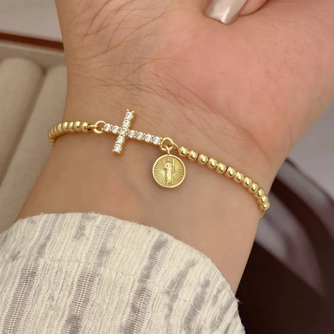 Pulsera cruz con dije